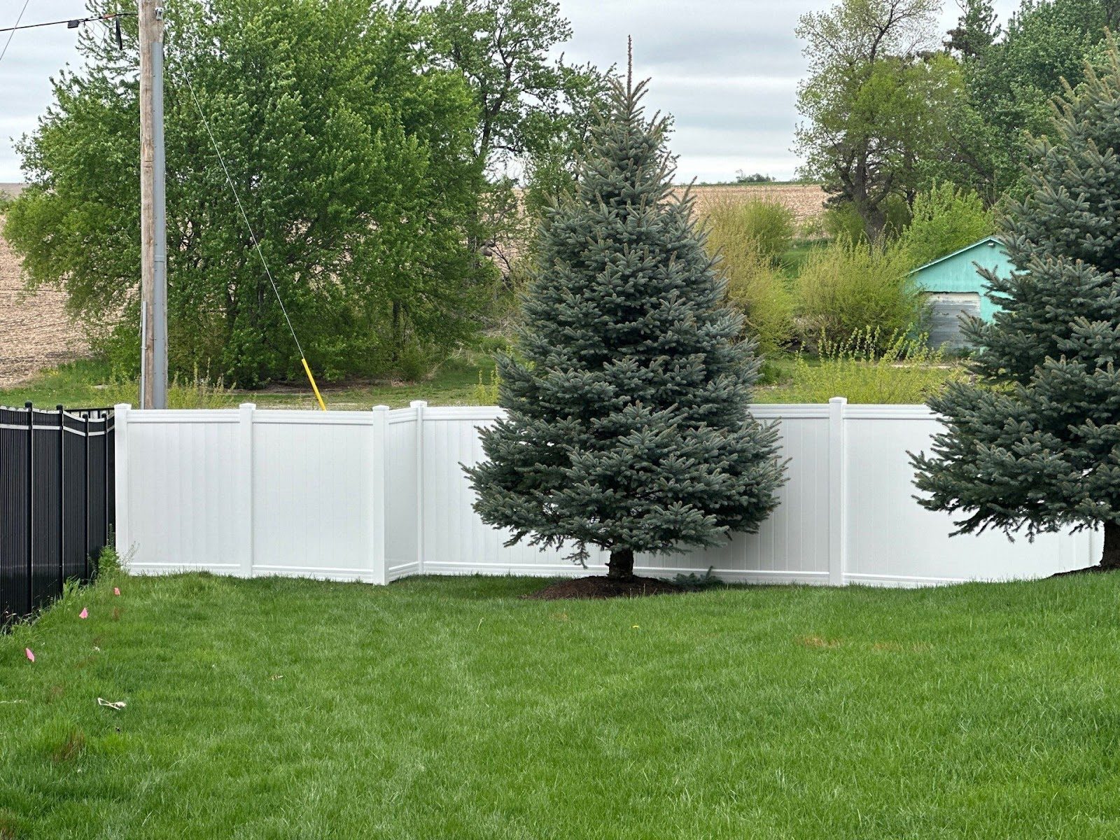 Vinyl privacy plus ornamental steel in Papillion